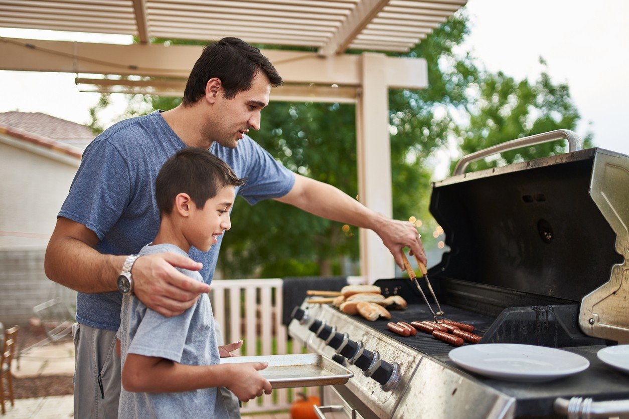 father and son grilling
