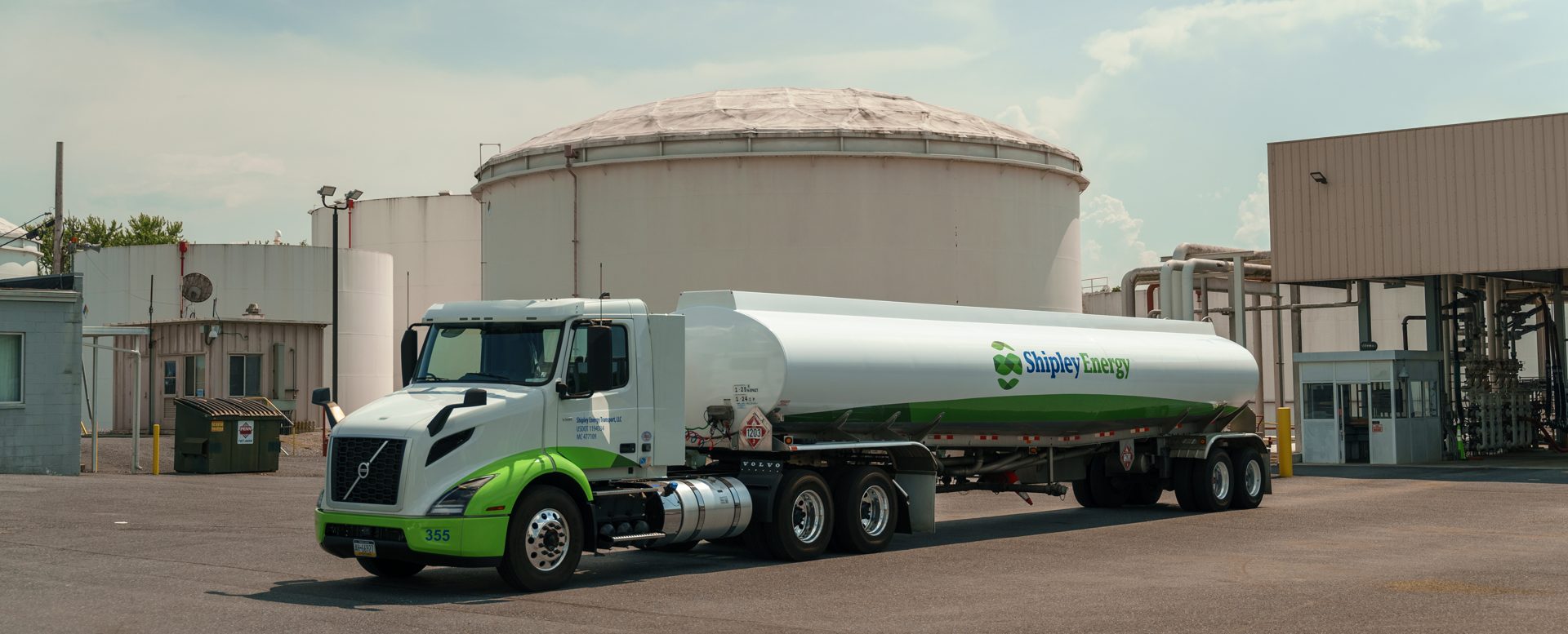 A Shipley Energy wholesale fuel truck in front of a fueling station